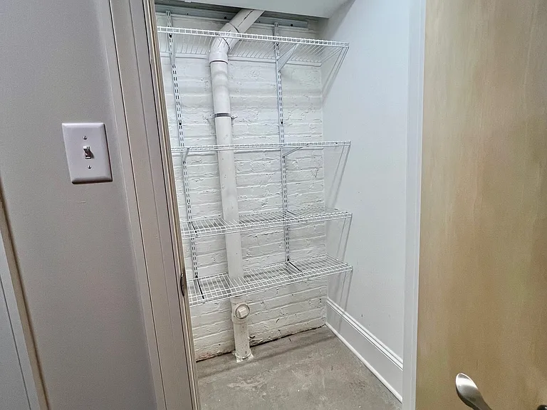 Large storage closet in downstairs hallway.
