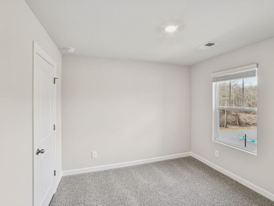 This secondary bedroom is perfect for guests or your home gym.