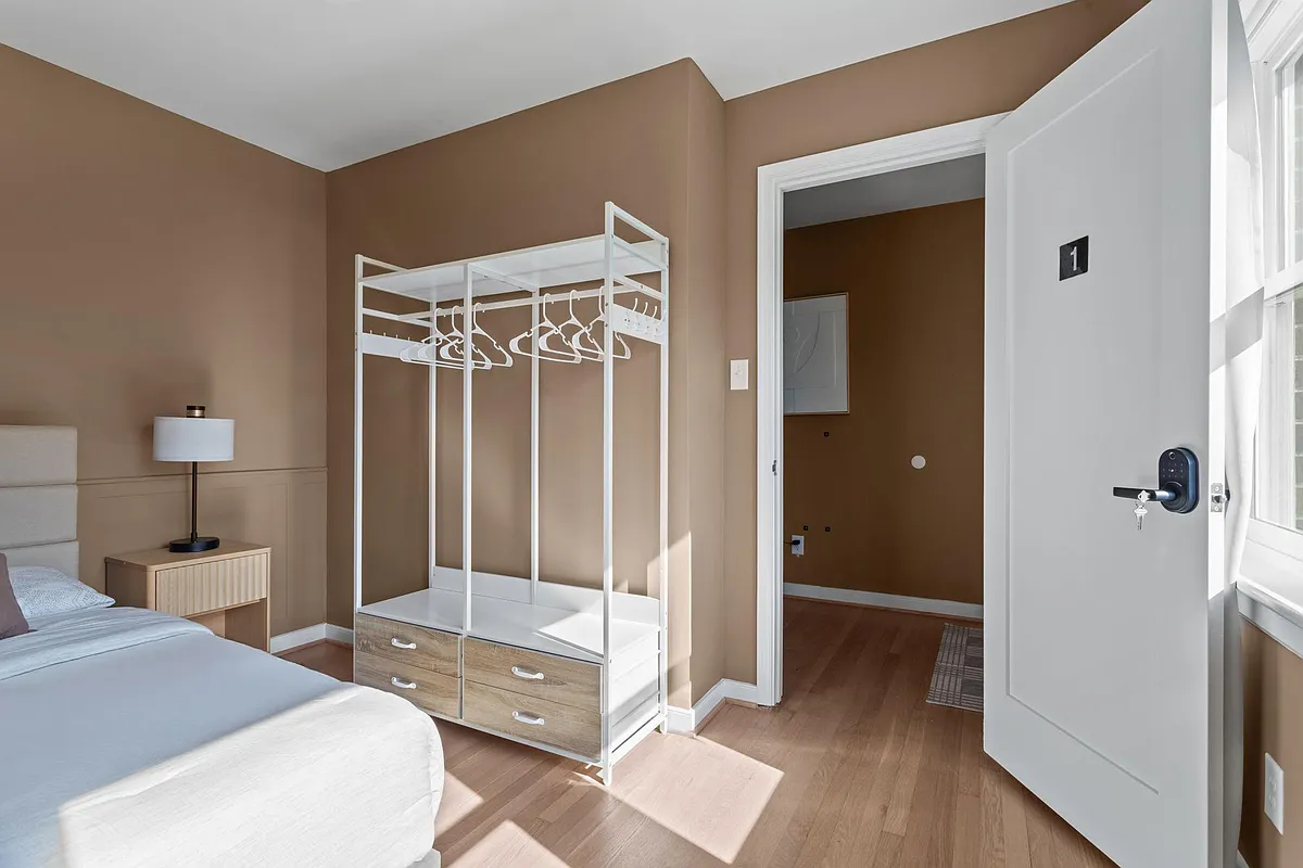 Room 1 - Second Floor near Front Entrance - Freestanding closet + bedside table + lamp + ceiling fan with integrated light - Midage Blvd