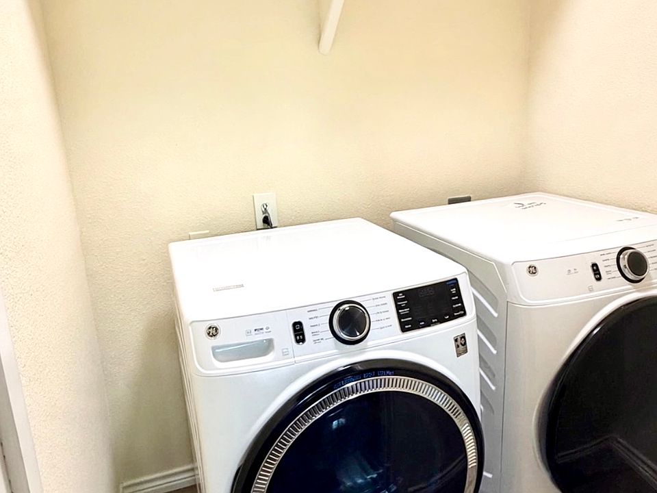 Laundry room, full-size front-load washer/dryer included, overhead storage shelf and hanging rod