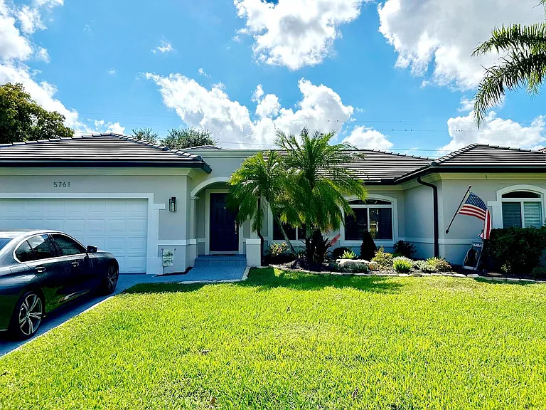 Front exterior with a two car garage