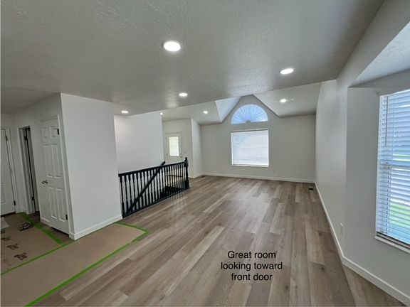 View of great room standing by bay window and looking toward the front of the home.
