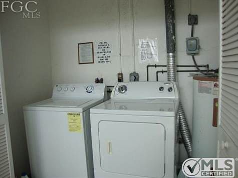 common laundry for bldg. between floors on back stairway alcove