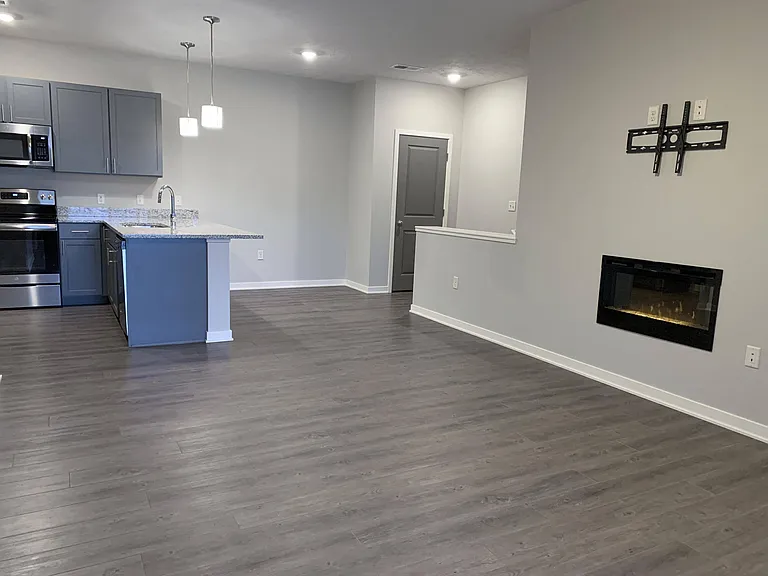 You'll love the open living areas, complete with a cozy fireplace, perfect for relaxing or entertaining.