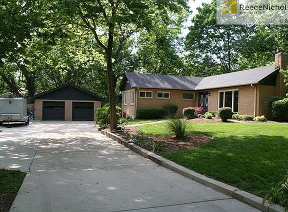 Roeland Park allows campers, trailers or boats to sit on the driveway as long as they sit further back than the front of house.  This extra long driveway provides access for the space.