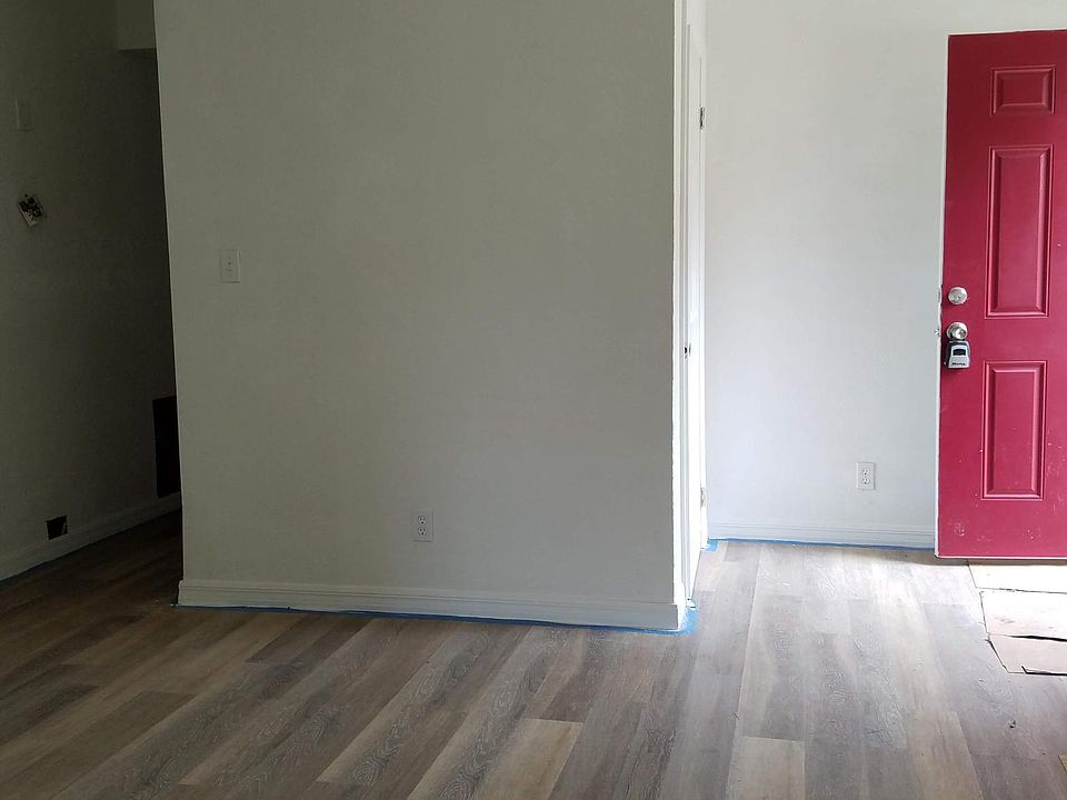 Front door entrance into living room with entrance closet
