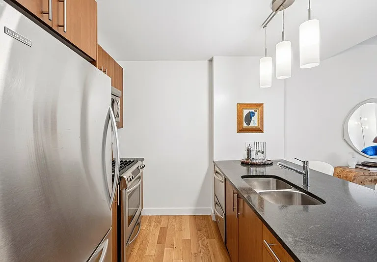 Step into contemporary elegance at Arbor, where modern kitchen design meets functionality. This sleek space features stainless steel appliances, stylish cabinetry, and warm hardwood flooring. Elevate your lifestyle todayschedule a tour now!