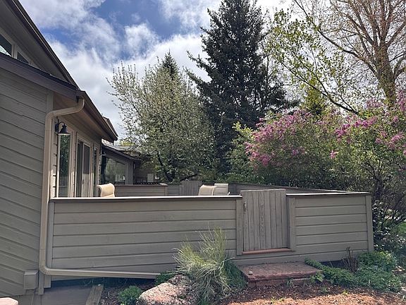 Large back patio, with mature trees and landscaping