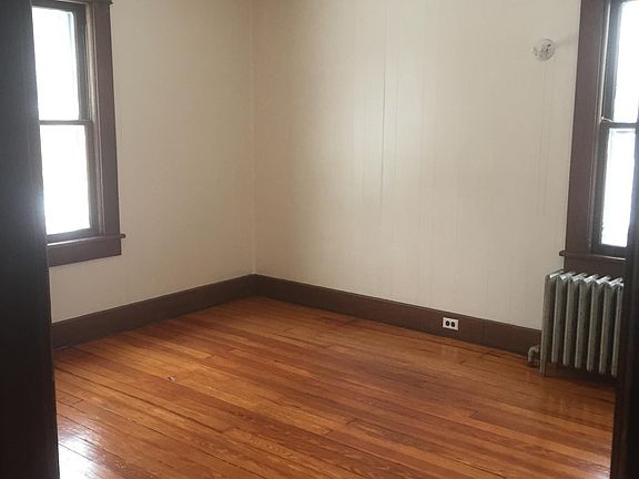 Front large BR after painting and redoing floors...Note tin ceiling and tons sunlight