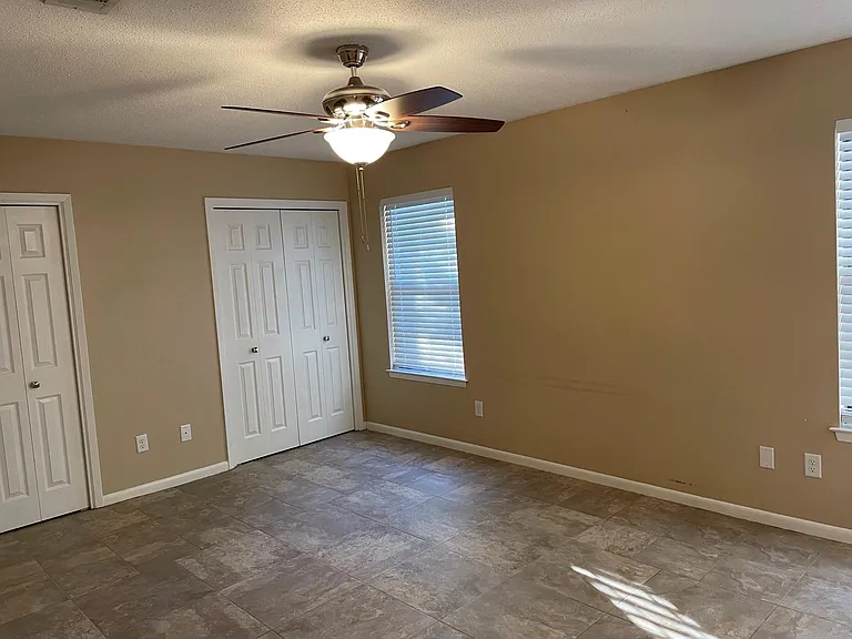 Master bedroom and view of double closets.