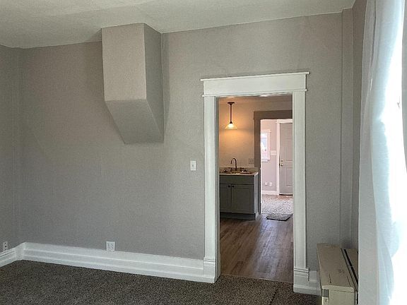 Living room looking into Kitchen and bedroom beyond