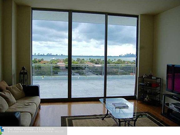 View out living room. You can see the large patio and downtown Miami.