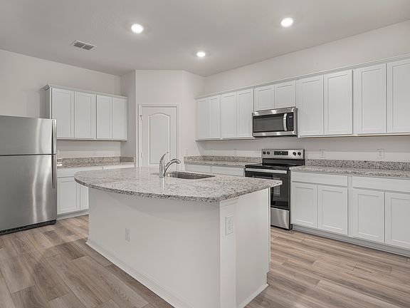 This move-in ready home features gorgeous granite countertops in the kitchen