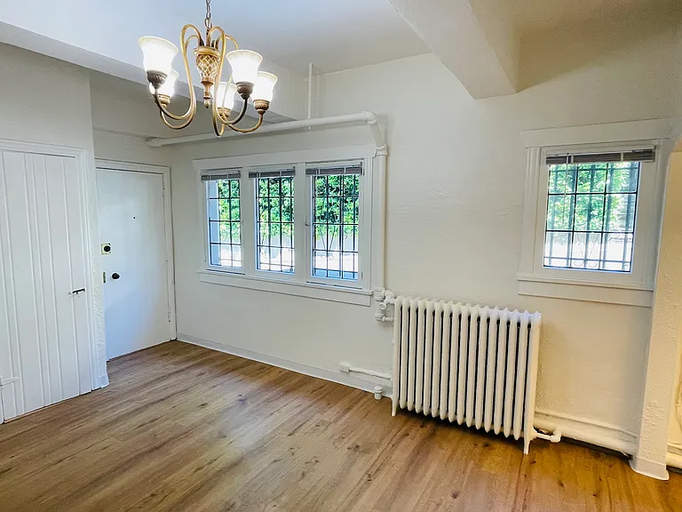 Main room with charming chandelier and leaded glass windows