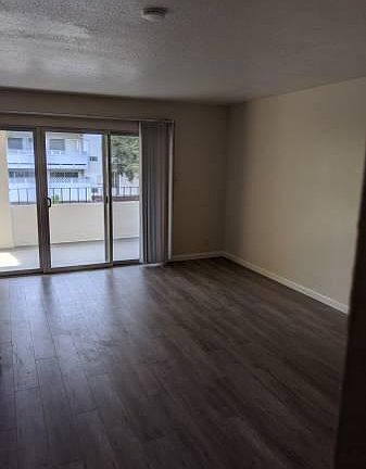 Living Room (brand new laminate floors throughout the unit)