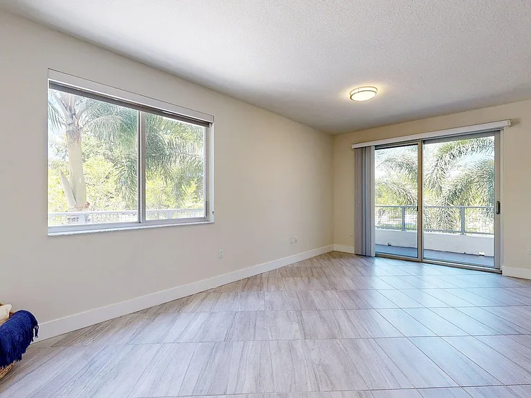 Apartment Living Room with Wood-Style Flooring and Patio/Balcony.