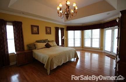 Master bedroom
						:
						Bedroom with sitting area & door to back patio.