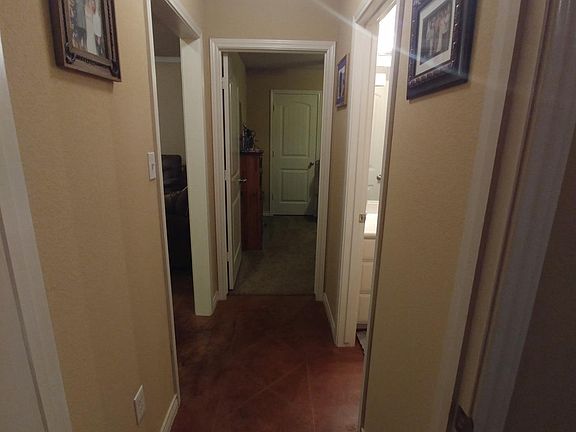 Hall connecting 2nd and 3rd bedroom and full bath