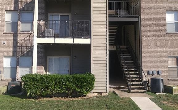 1st floor unit with balcony.  View of open fields and hike/bike trail directly behind unit.