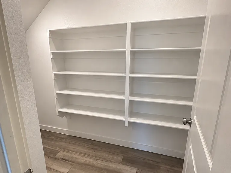 Walk in pantry and storage area, view from wall in by garage and kitchen