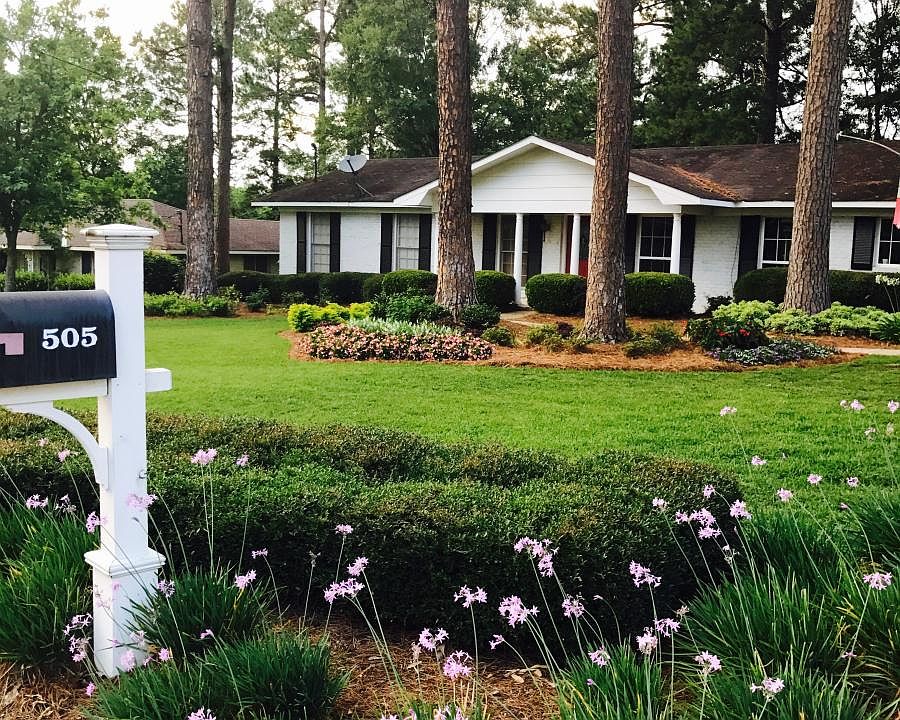Professional landscape flower program, maintenance, and lawn care included in rent price.