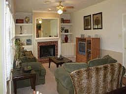 Focal point of the family room is the elegant fireplace surrounded by built-in cabinetry.