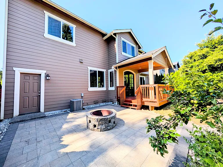 Backyard - concrete pavers, wood firepit, and wood deck.
Direct access from garage too (door on the left)