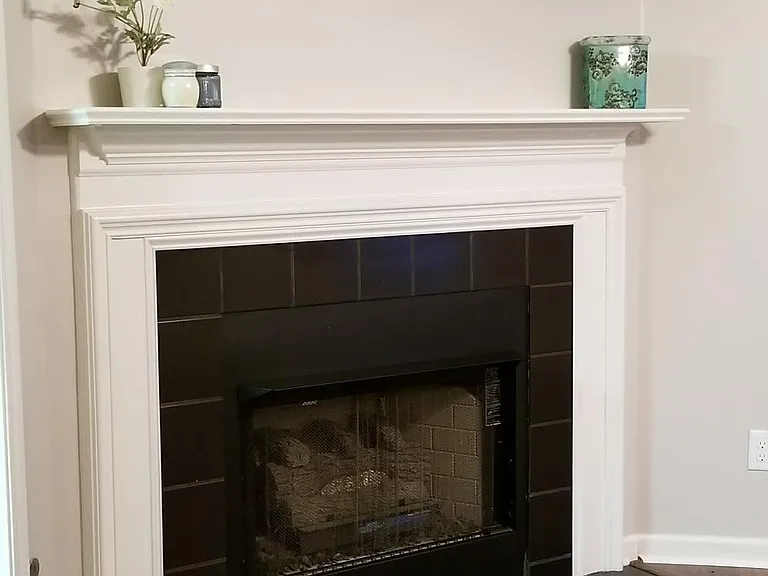 Lovely gas fireplace and mantel in living room