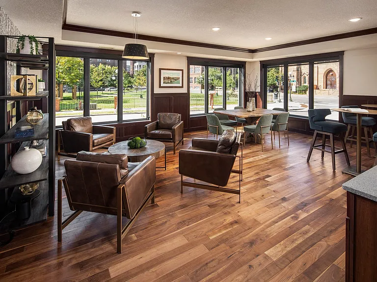 View of coffee lounge with tables and chairs at The Whitley.
