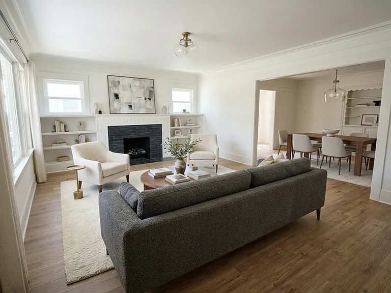 Large Living Room with built-in book shelves and fireplace with gas appliance. Virtual Staging