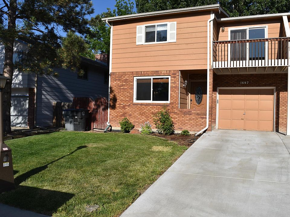 Exterior of duplex, one car garage with opener
