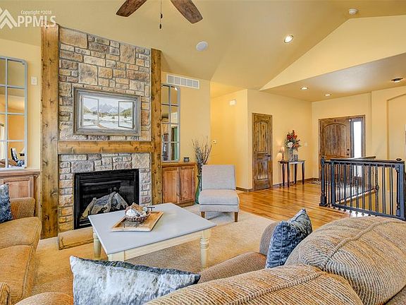 Family Room w/ Vaulted Ceiling & Cozy Fireplace