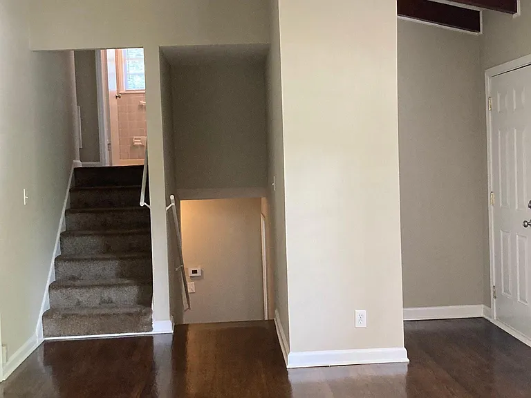 Living room showing stairs up/down