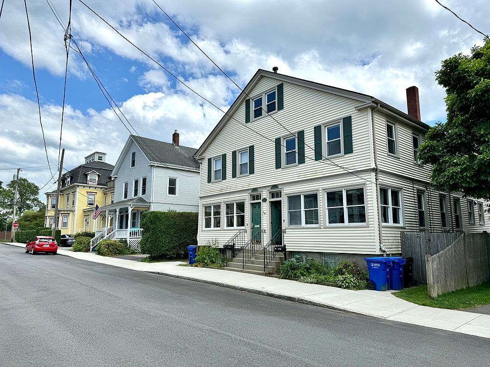 Exterior view of the property set on a wide, quiet street.