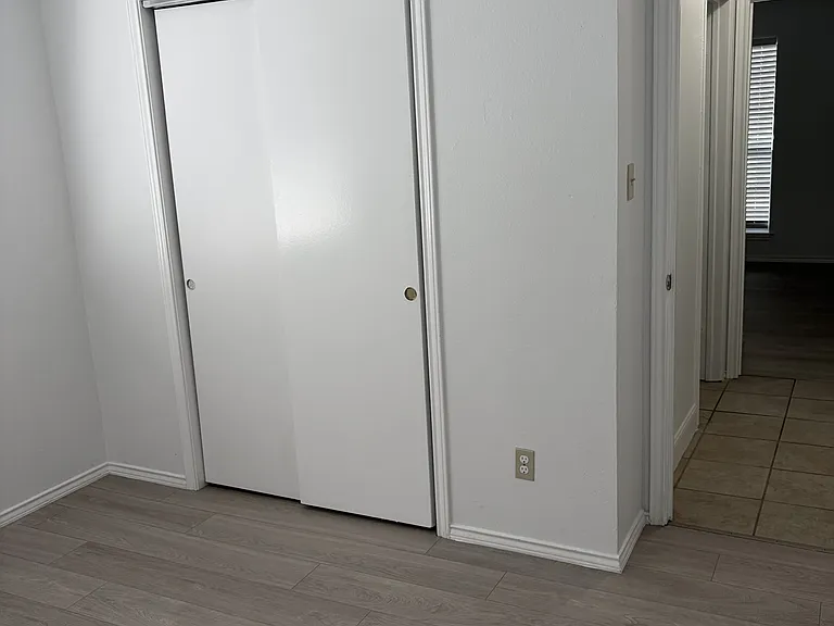 Secondary bedroom #2 closets and entry hallway