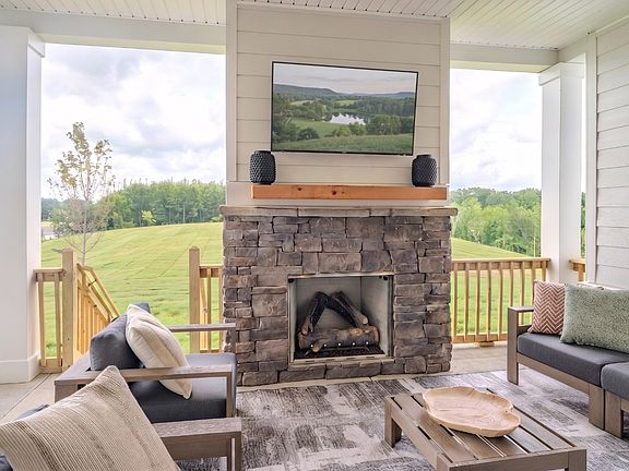 Spacious rear covered patio with fireplace