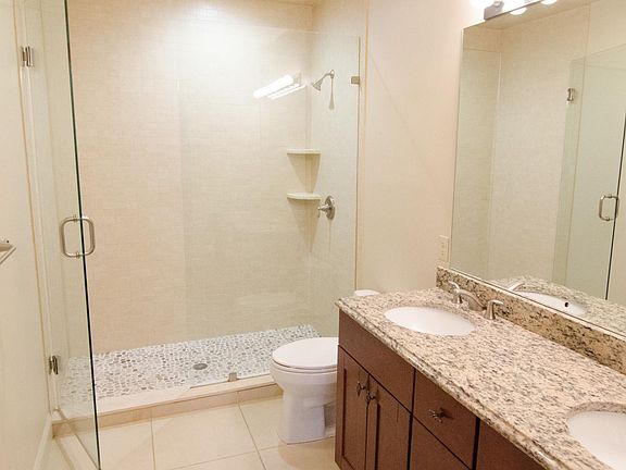 Bathroom w/ Dual Vanity and oversized walk in shower