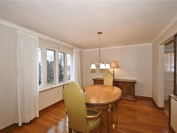 Spacious and bright dining room opens to the kitchen. The large picture window allows the natural light to brighten the room.
