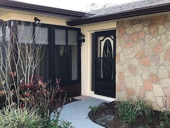 Inviting entry with new storm door.