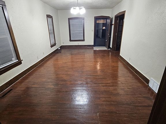 Looking at front door from kitchen. Master bedroom off to the right by the front door.