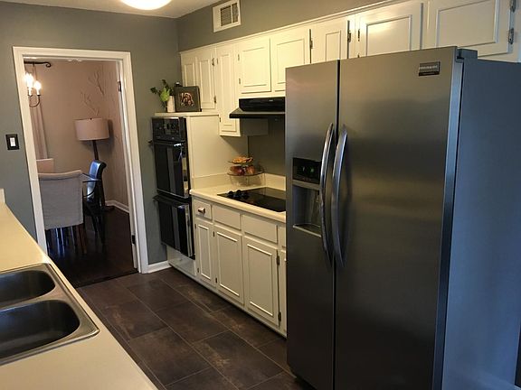 stainless refrigerator , double oven, flat cooktop