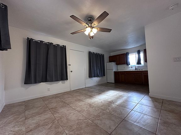 looking into front yard with closed shades.