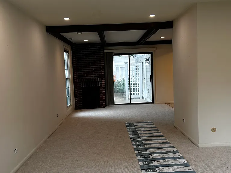 Living room and dining room with Chimney facing South