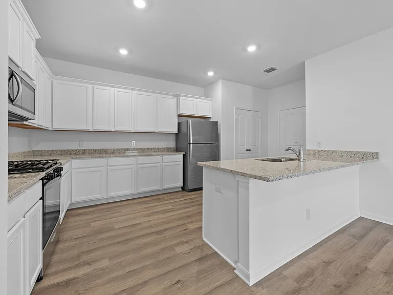 Kitchen appliances included.
