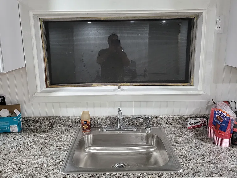 Kitchen sink with window that looks out to pond