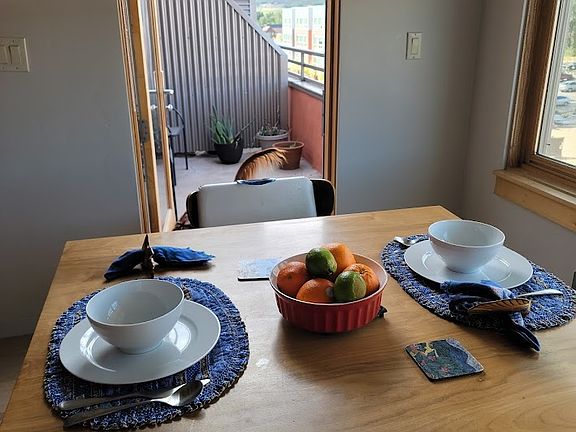 The kitchen table opens up to the balcony