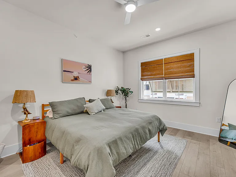 Master bedroom with plenty of room around a king size bed