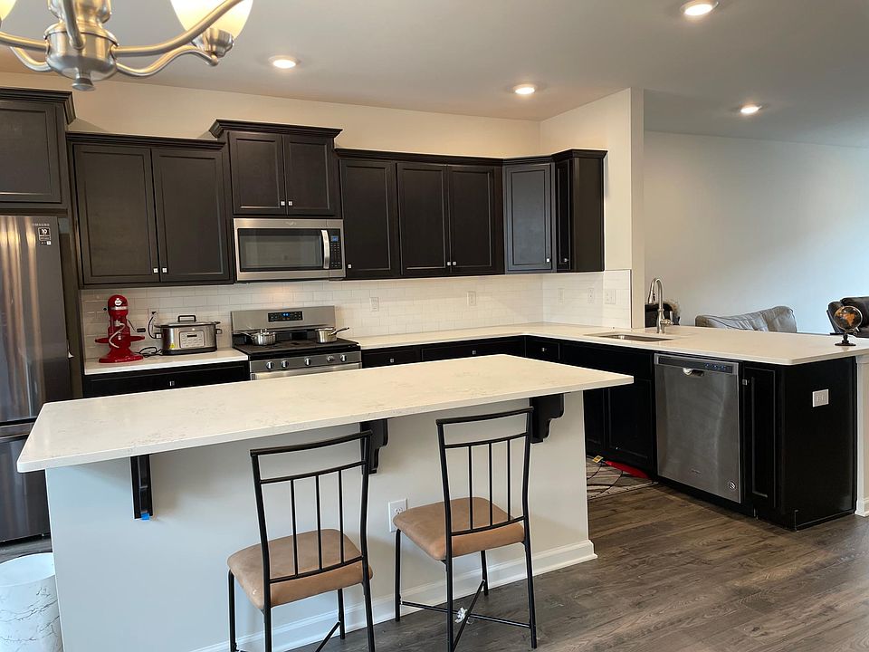 kitchen with quartz counters stainless steel appliance brand new