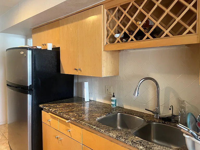 Small wine rack in the kitchen.