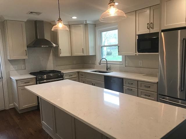 Custom cabinets, new kitchen, gas range, quartz countertops